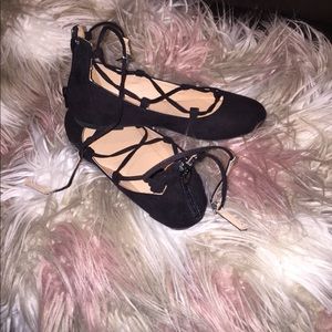 Girls black lace up ballet flats.